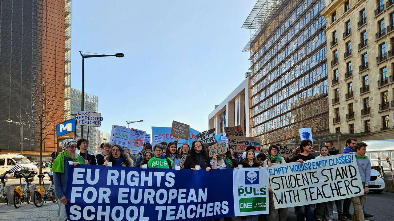 European schoolteachers take part in a protest during an half-day strike outside the EU institutions headquarters in Brussels