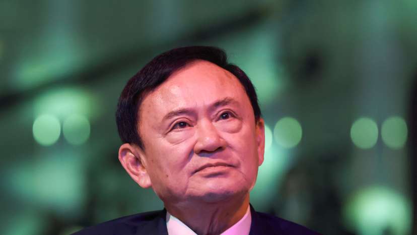 Thailand’s former Prime Minister Thaksin Shinawatra reacts ahead of a panel discussion with Thai broadcaster Nation TV, in Bangkok