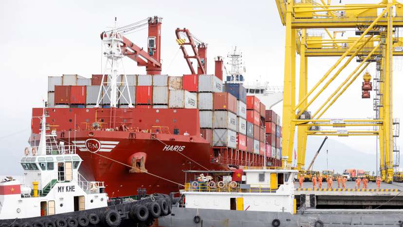 Containers are loaded onto a ship at Tien Sa port in Da Nang city