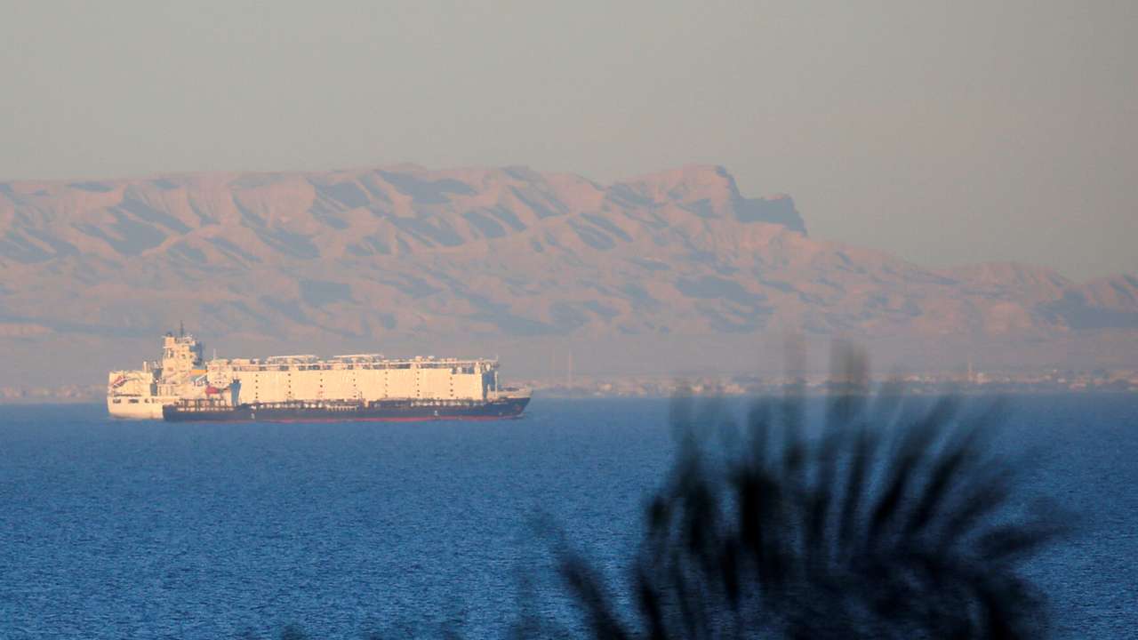 FILE PHOTO: Container ships sail across the Gulf of Suez towards the Red Sea before entering the Suez Canal, in El Ain El Sokhna in Suez
