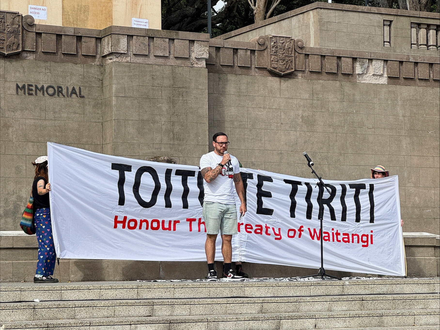 Anaru Ryall speaks at a protest demanding New Zealand's government to honour the Treaty of Waitangi in Wellington