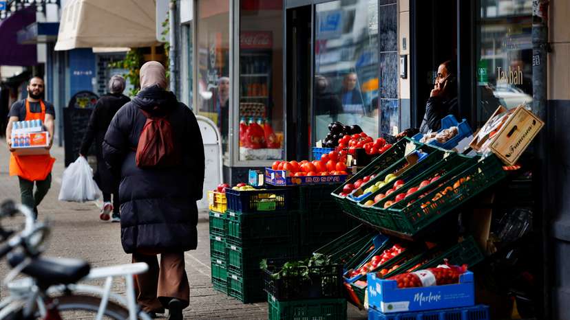 People walk past shops in Kanaleneiland, an immigrant-dominated area of Utrecht