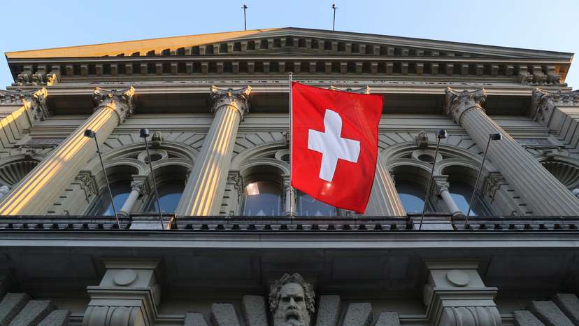 Switzerland's national flag flies at the Swiss Federal Palace in Bern