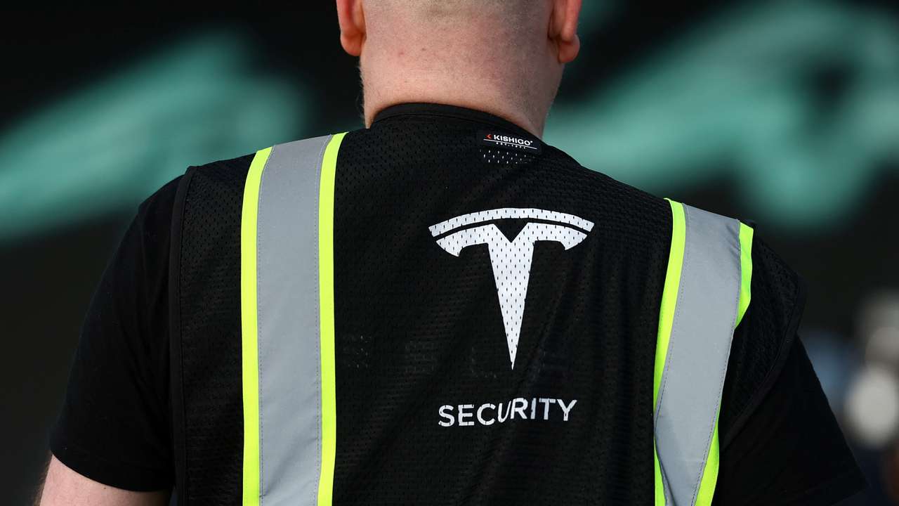 Tesla's Gigafactory halts its production after a suspected arson attack, in Gruenheide