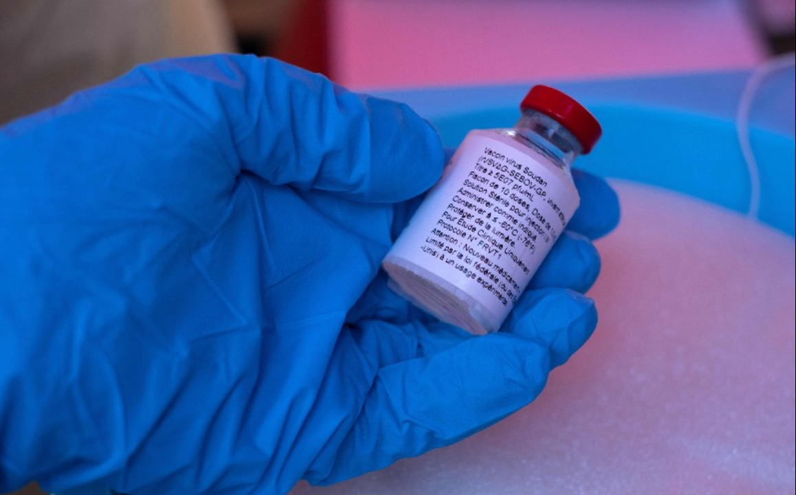A nurse holds a vial of the Ebola Sudan vaccine during the launch of an Ebola trial vaccination campaign at Mulago Referral Hospital in Kampala