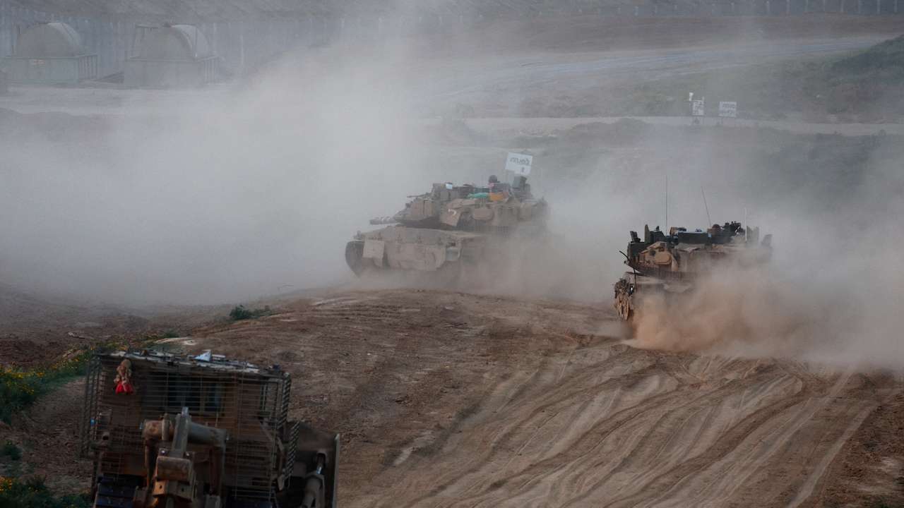 A convoy enters Gaza, amid the ongoing conflict between Israel and Palestinian Islamist group Hamas, in Southern Israel