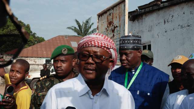 Guinea-Bissau's President Umaro Sissoco Embalo talks with journalists after voting during the presidential election at a polling station, Umaro Djabula in Gabu, Guinea-Bissau, November 23, 2025. REUTERS/Luc Gnago.