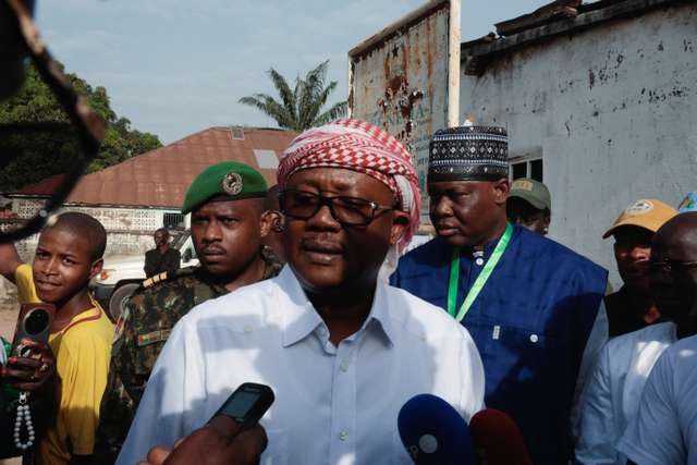 Guinea-Bissau's President Umaro Sissoco Embalo talks with journalists after voting during the presidential election at a polling station, Umaro Djabula in Gabu, Guinea-Bissau, November 23, 2025. REUTERS/Luc Gnago.