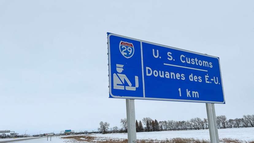 FILE PHOTO: Snow covers the ground around a sign near the Emerson-Pembina crossing in Emerson, Manitoba