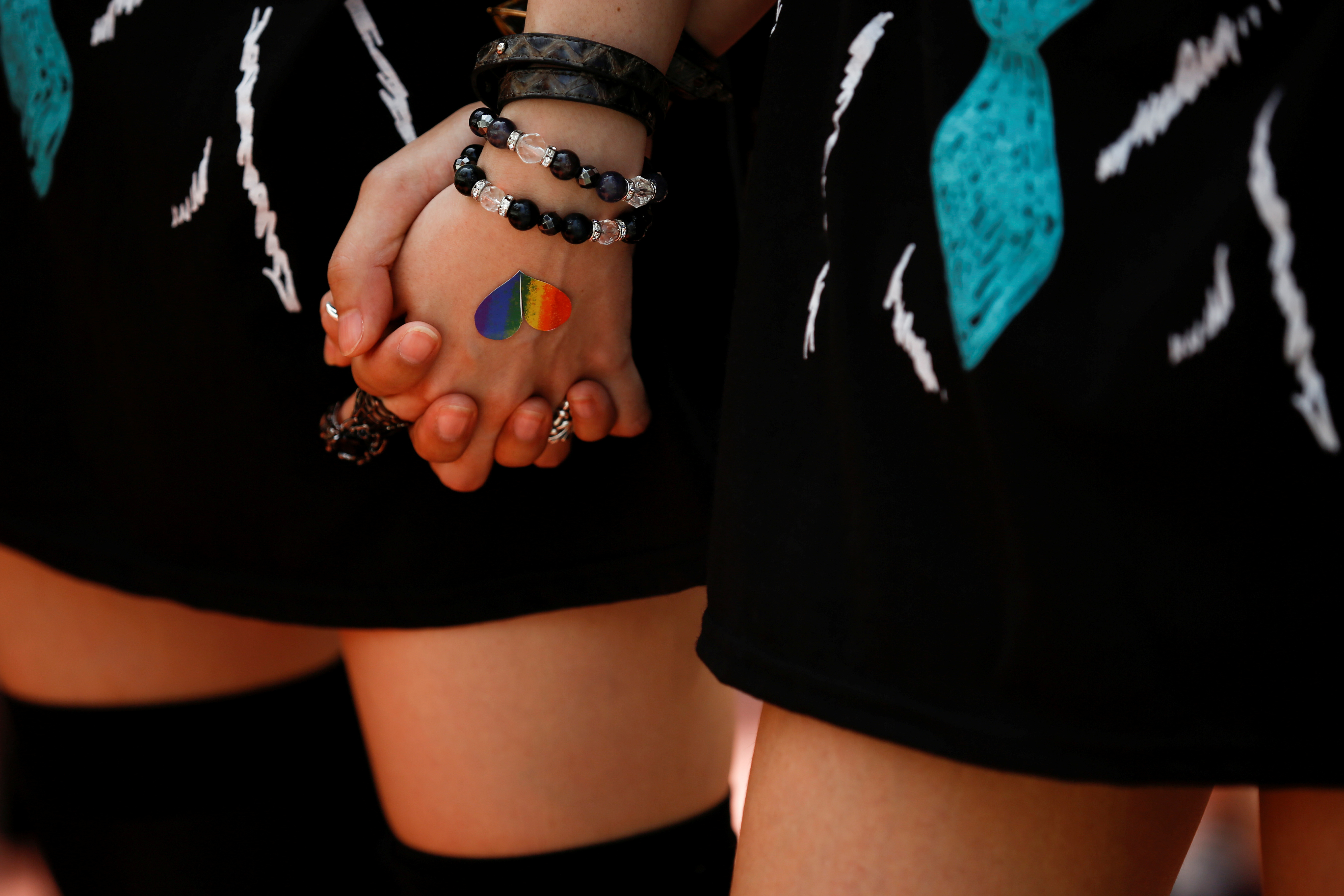 FILE PHOTO: Women hold hands during the Tokyo Rainbow Pride parade in Tokyo