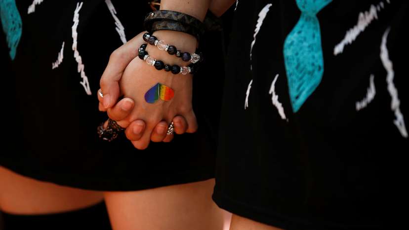 FILE PHOTO: Women hold hands during the Tokyo Rainbow Pride parade in Tokyo
