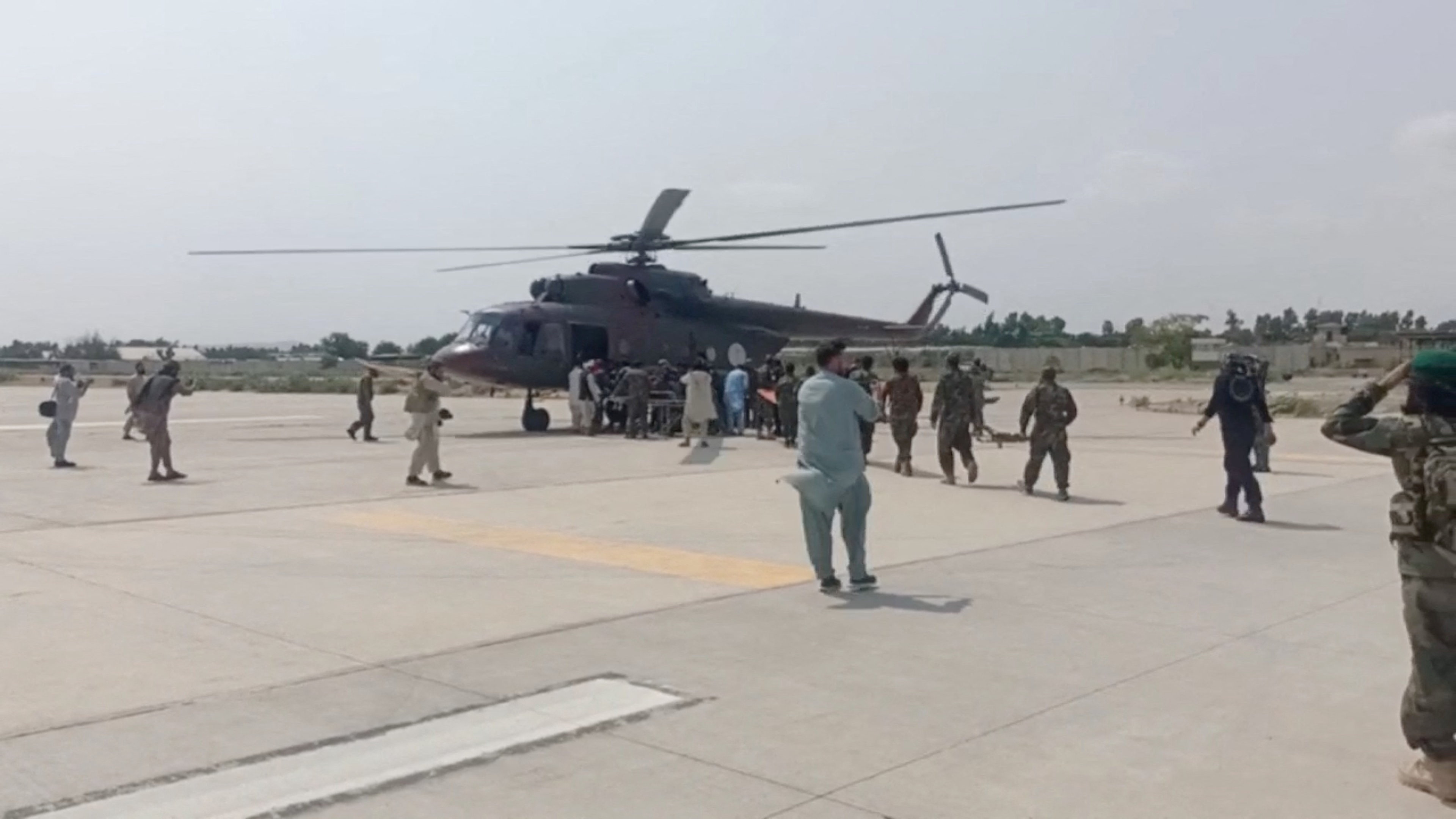 A helicopter carrying casualities lands at Nangarhar airport, in Jalalabad