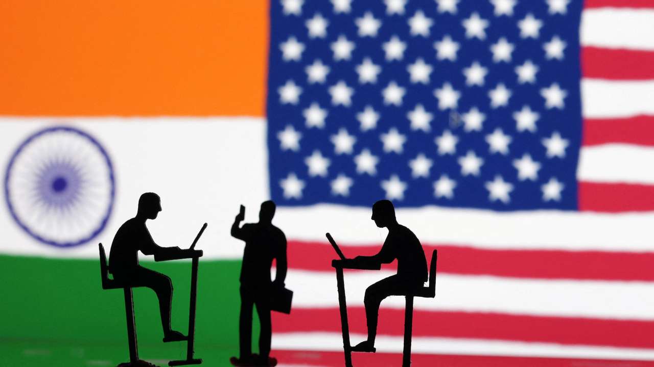 Illustration shows the Indian and U.S. flags and people miniatures