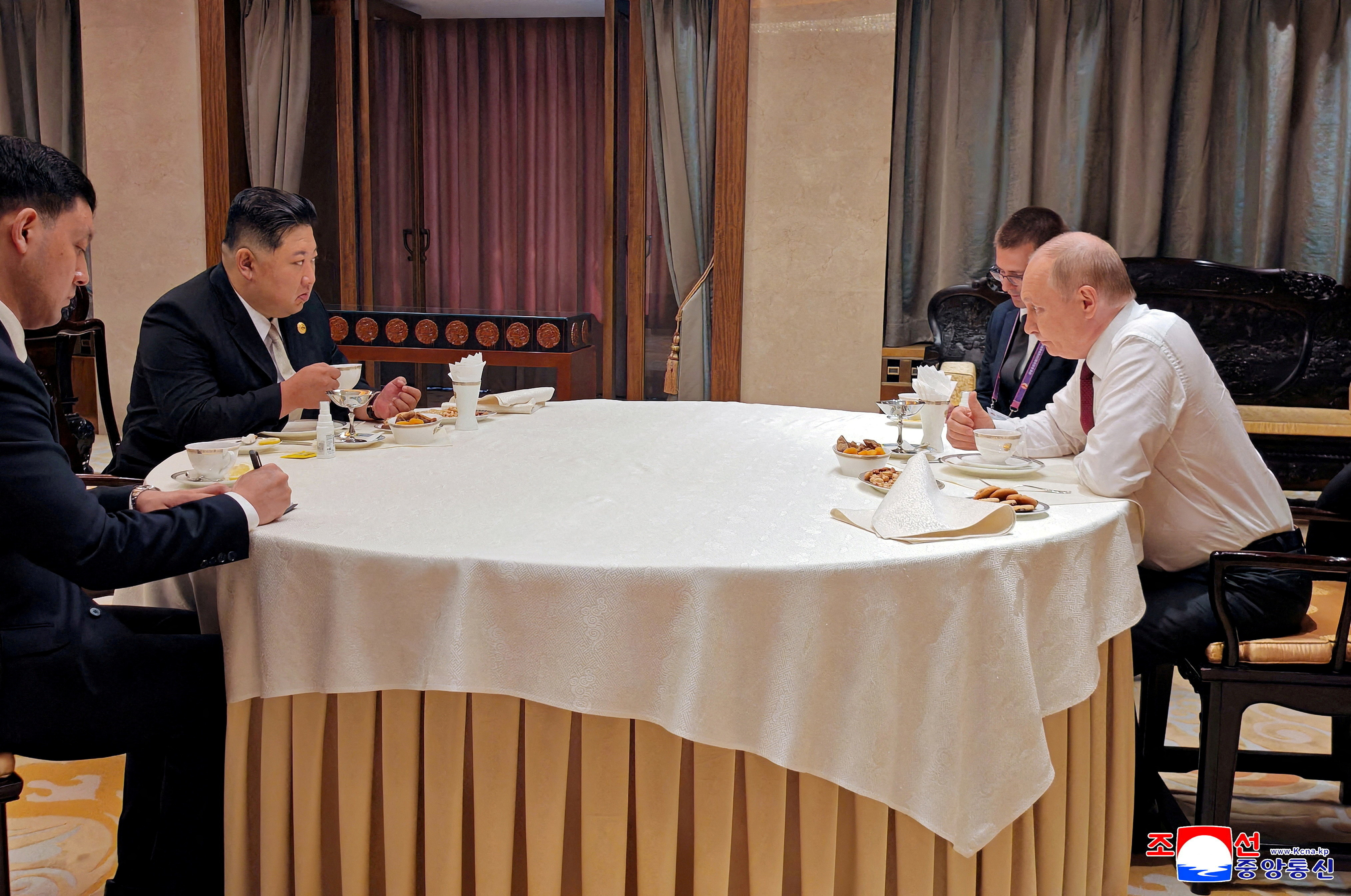 FILE PHOTO: North Korean leader Kim Jong Un meets Russian President Vladimir Putin in Beijing