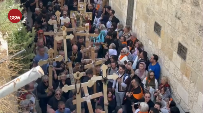 Christians carry cross in old Jerusalem to mark Good Friday