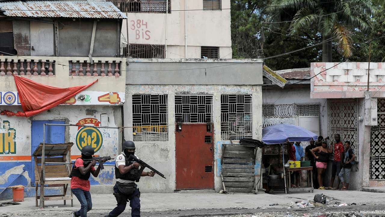 FILE PHOTO: Police patrol the streets after gang members tried to attack a police station, in Port-au-Prince