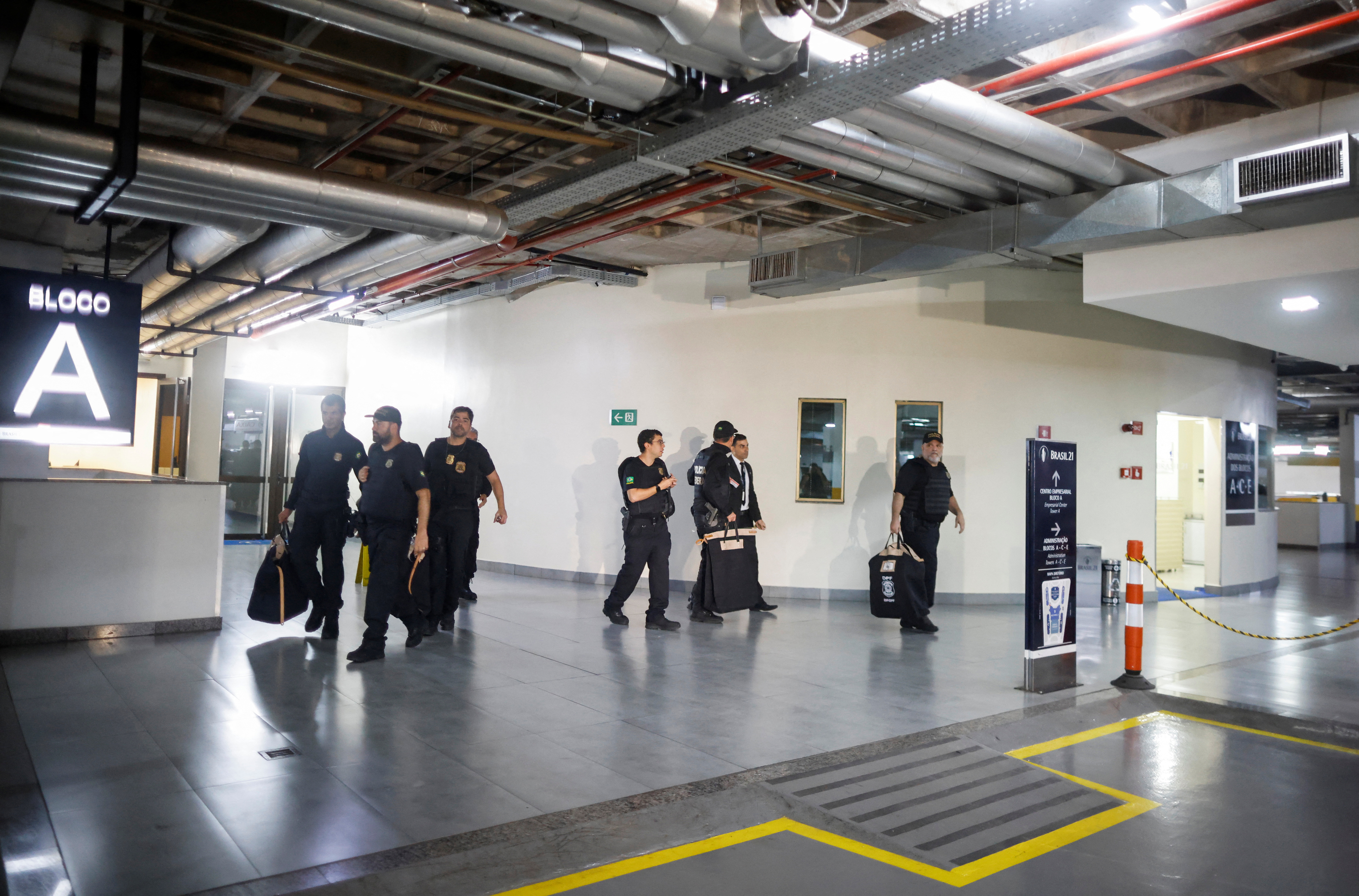 FILE PHOTO: Federal police officers leave the headquarters of the Liberal Party during an operation targeting some of former President Jair Bolsonaro's top aides in Brasilia
