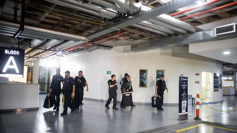 FILE PHOTO: Federal police officers leave the headquarters of the Liberal Party during an operation targeting some of former President Jair Bolsonaro's top aides in Brasilia