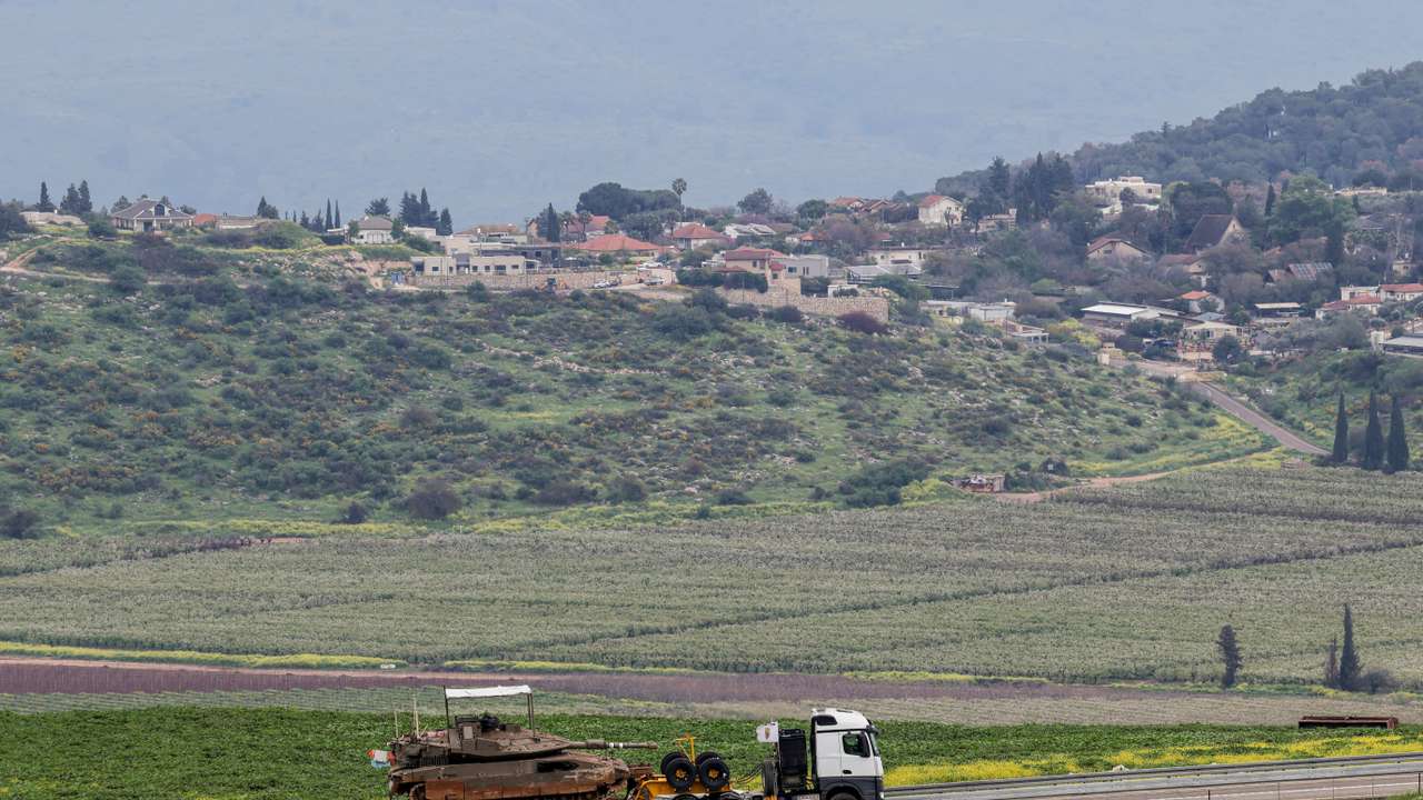 An Israeli tank is transported near the Israeli side of the border with Lebanon, amid escalating hostilities between Israel and Hezbollah, as the U.S.-Israeli conflict with Iran continues