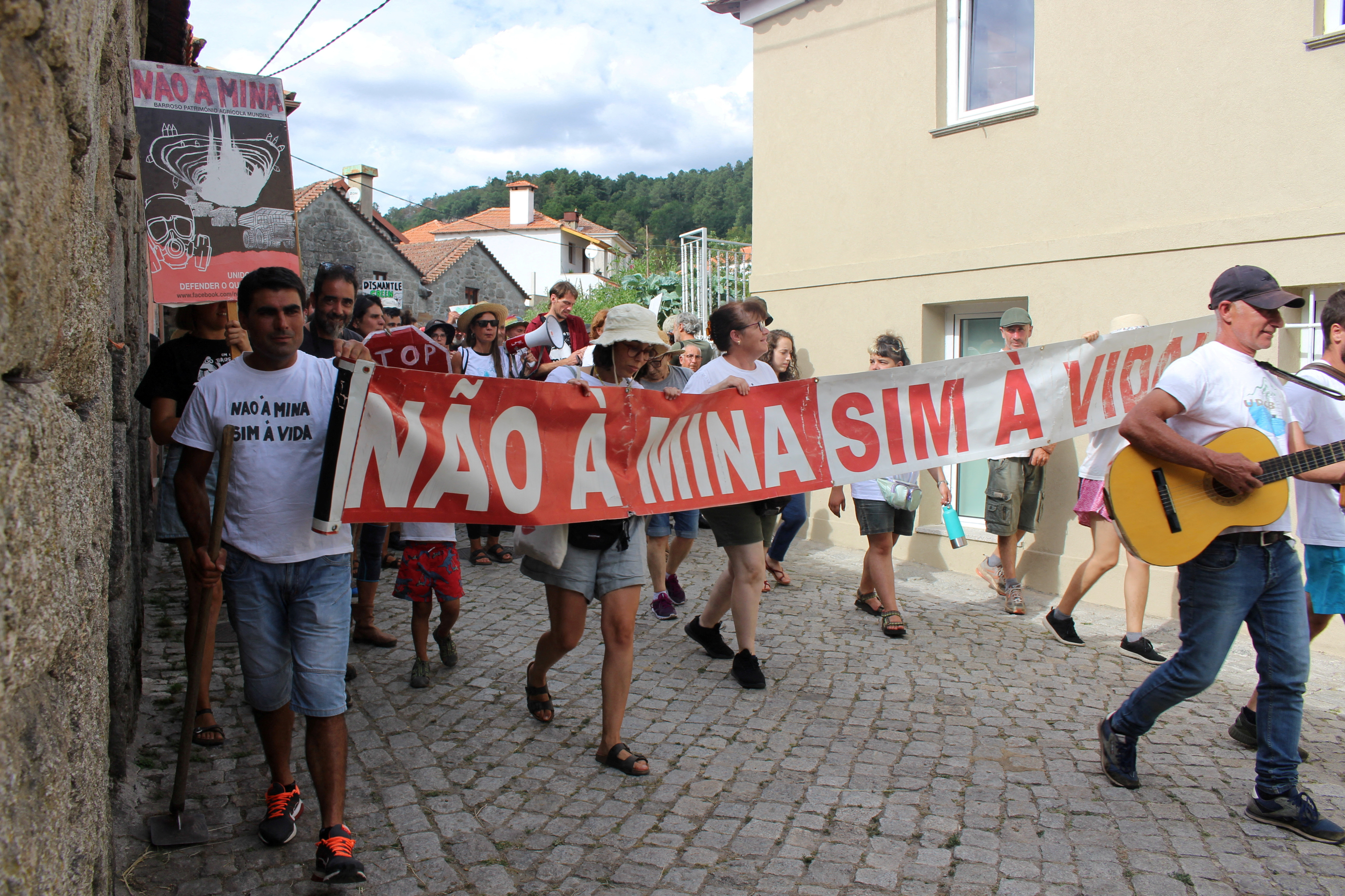 FILE PHOTO: People carrying a banner saying "No to the mine. Yes to life" take part in a anti-lithium protest in Covas do Barroso