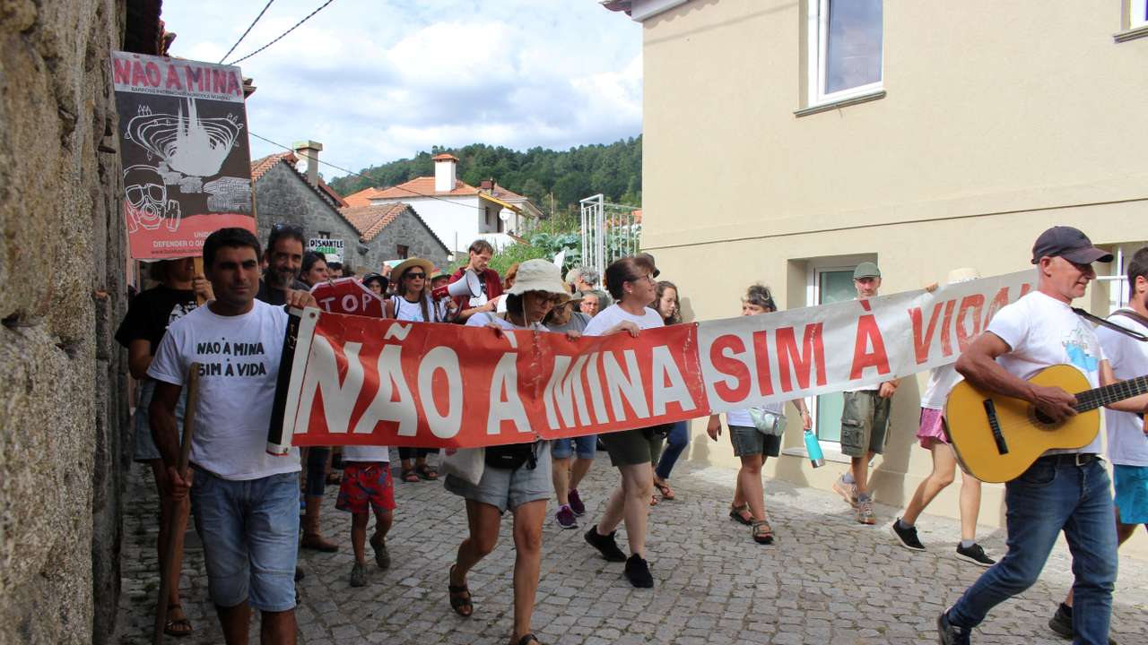 FILE PHOTO: People carrying a banner saying "No to the mine. Yes to life" take part in a anti-lithium protest in Covas do Barroso