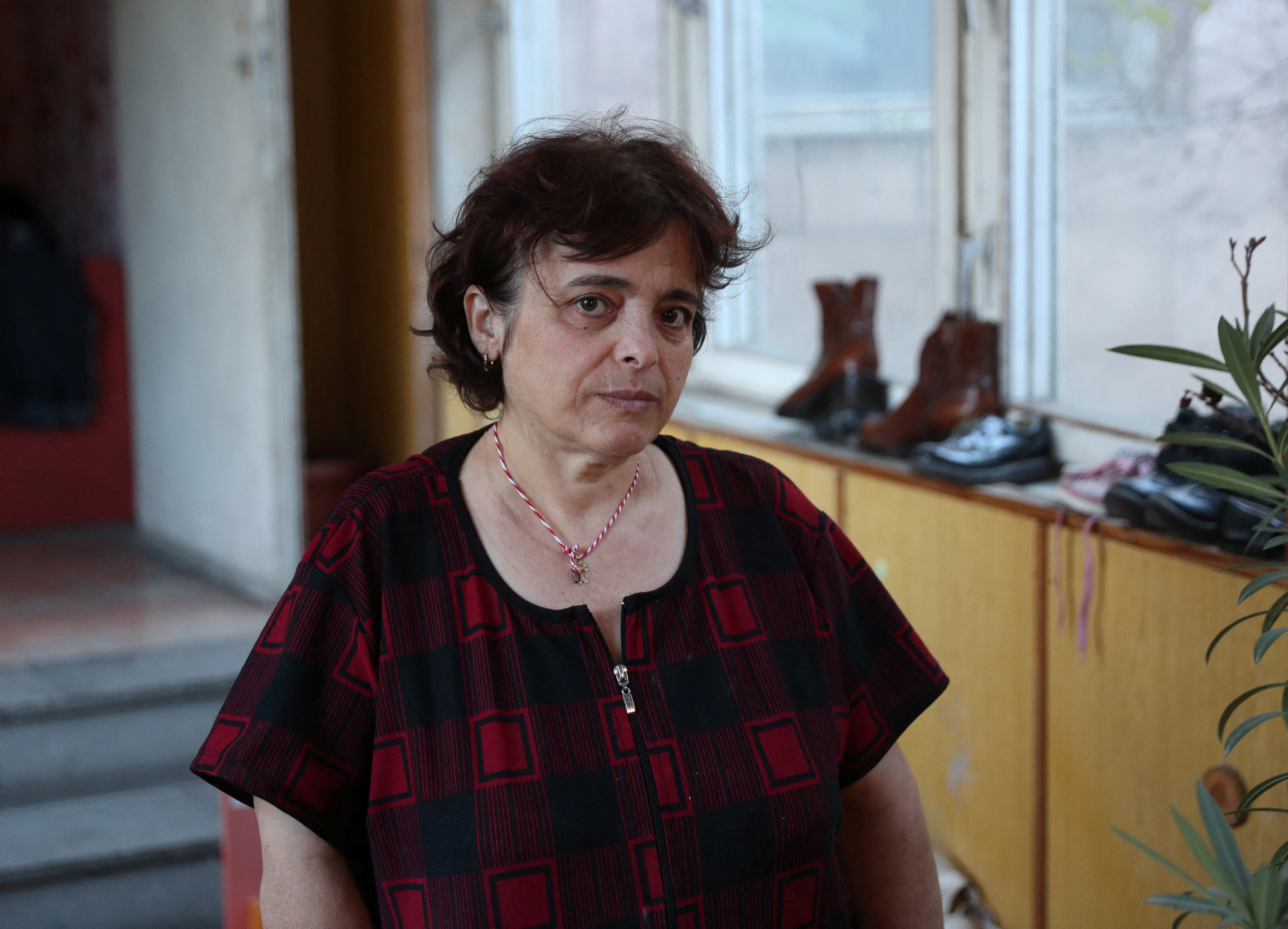 Refugee from Nagorno-Karbakh region Elada Sargsyan poses for a picture in a disused kindergarten where she lives in Masis