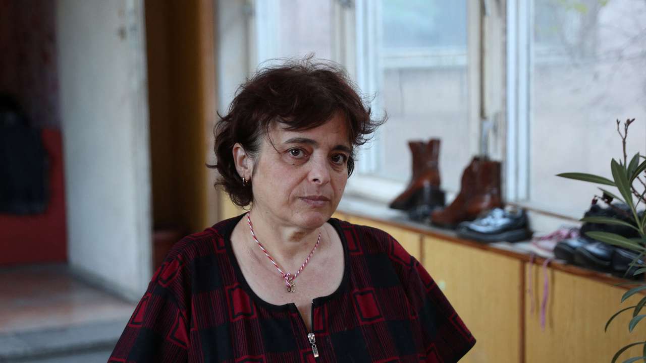Refugee from Nagorno-Karbakh region Elada Sargsyan poses for a picture in a disused kindergarten where she lives in Masis