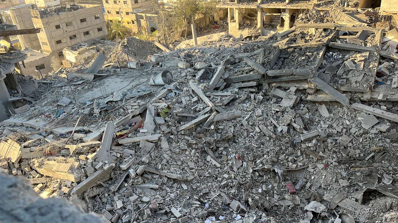 A multi-storey residential building lies in ruins following an Israeli strike, in Beit Lahiya in the northern Gaza Strip