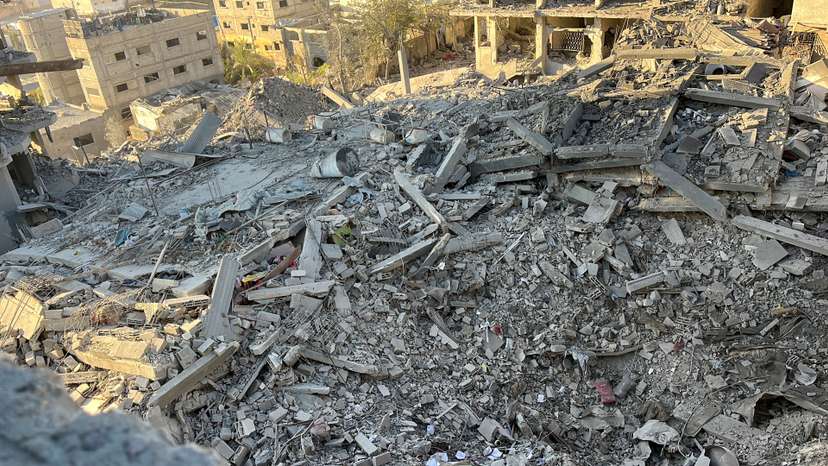 A multi-storey residential building lies in ruins following an Israeli strike, in Beit Lahiya in the northern Gaza Strip