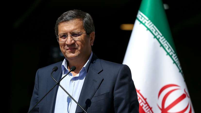 Presidential candidate Abdolnaser Hemmati speaks with journalists before the start of the last election debate, in Tehran