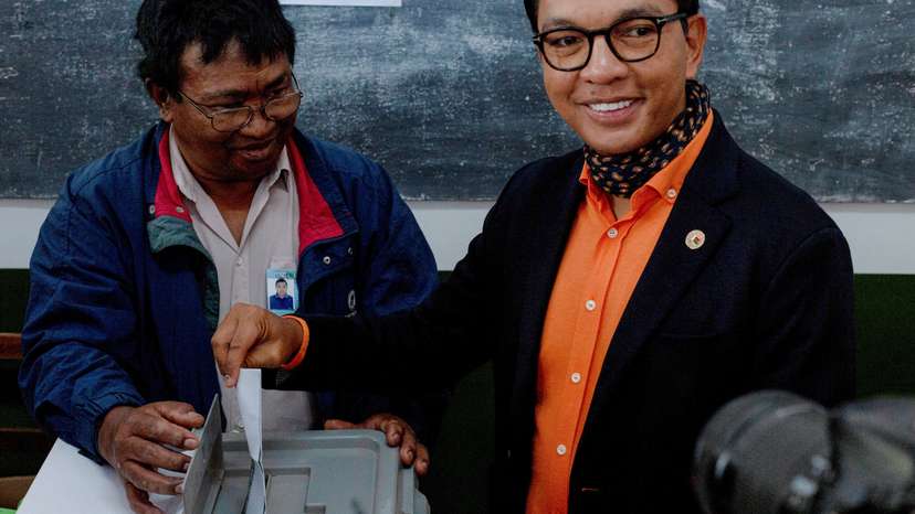 Madagascar's President and a presidential candidate Andry Rajoelina casts his ballot at a polling station during the presidential election in Ambatobe