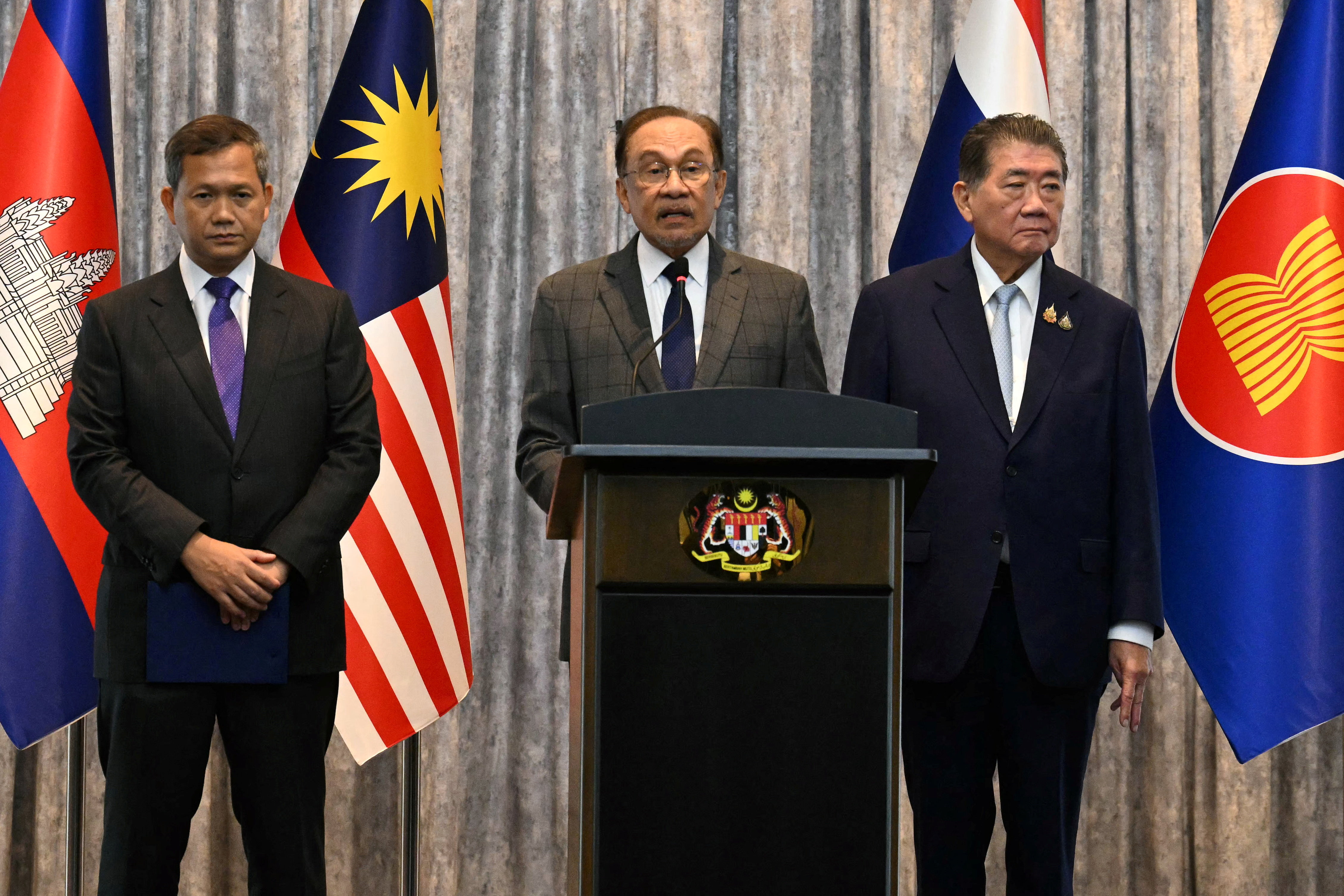 Malaysia's Prime Minister Ibrahim, Cambodia's Prime Minister Manet and Thailand's acting Prime Minister Wechayachai take part in mediation talks, in Putrajaya