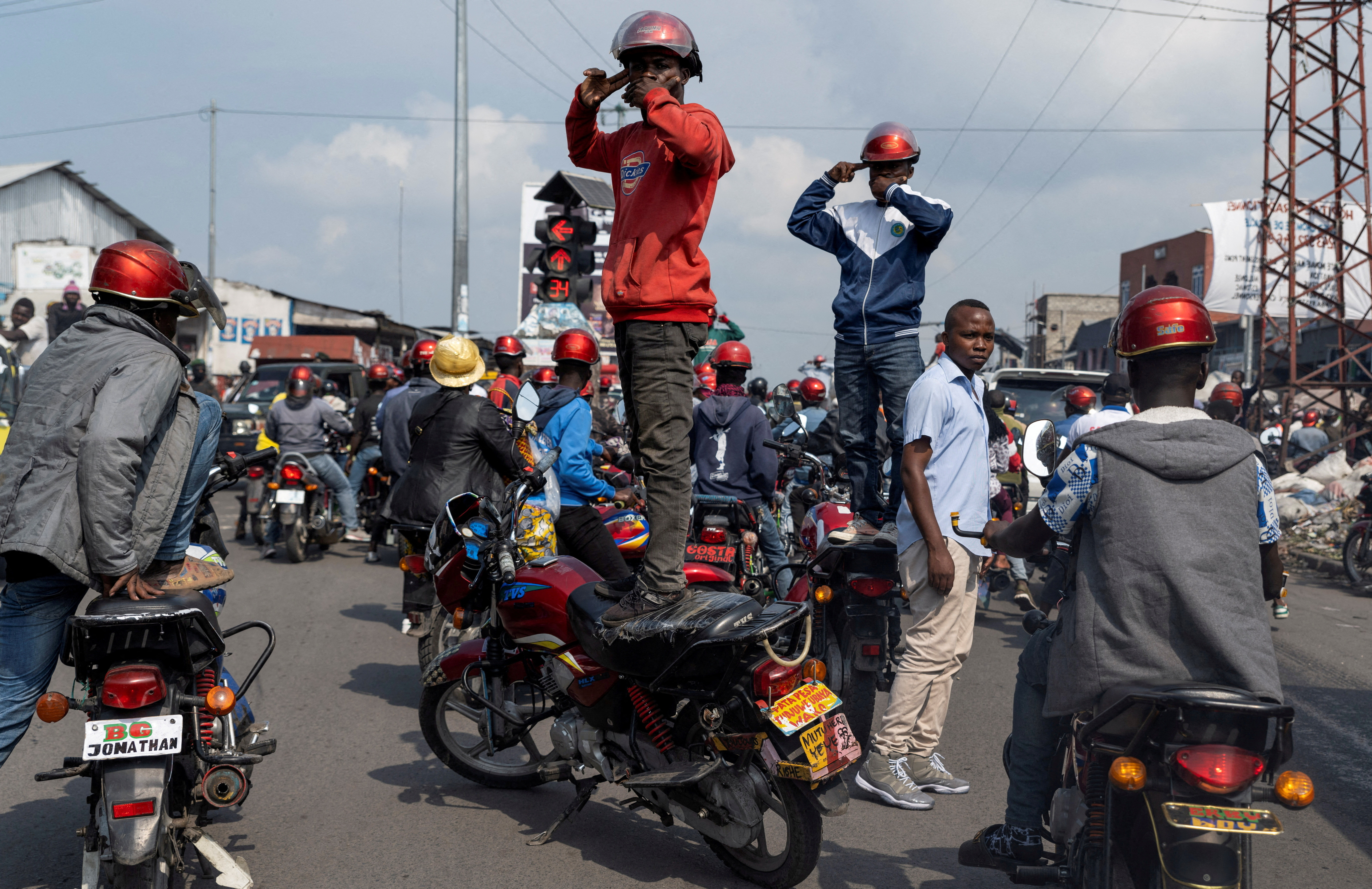 FILE PHOTO: Activists march during a demonstration calling for an end to the fighting between the M23 rebels and the Congolese army and denouncing the international community's silence on the conflicts in Goma