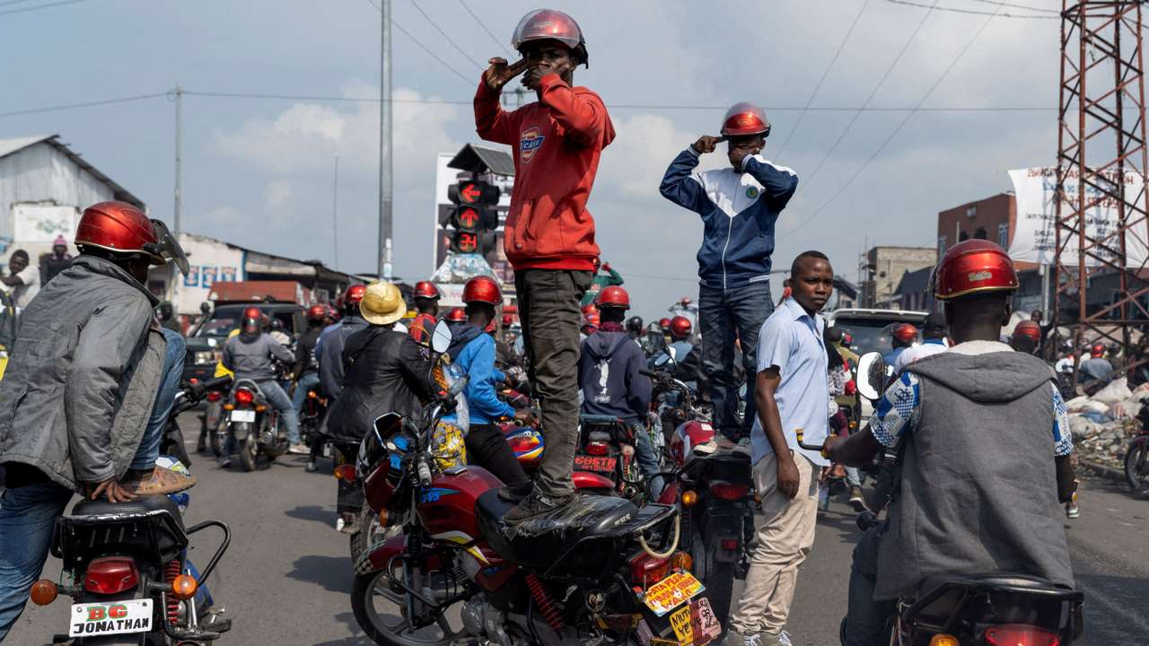 FILE PHOTO: Activists march during a demonstration calling for an end to the fighting between the M23 rebels and the Congolese army and denouncing the international community's silence on the conflicts in Goma