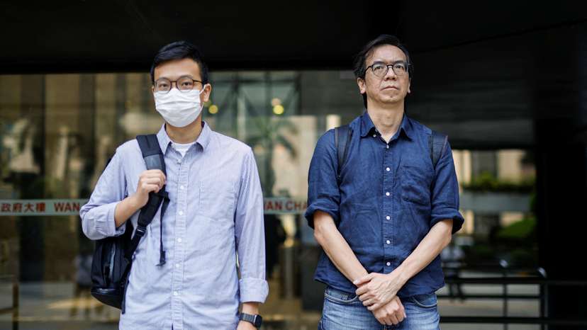 Chung Pui-kuen, former chief editor of the now-shuttered Stand News, and Patrick Lam, former acting chief editor, leave the District Court in Hong Kong