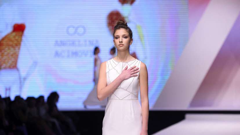Dresses based on drawings of a victim of Serbia's school shooting are presented during a Fashion Week in Belgrade