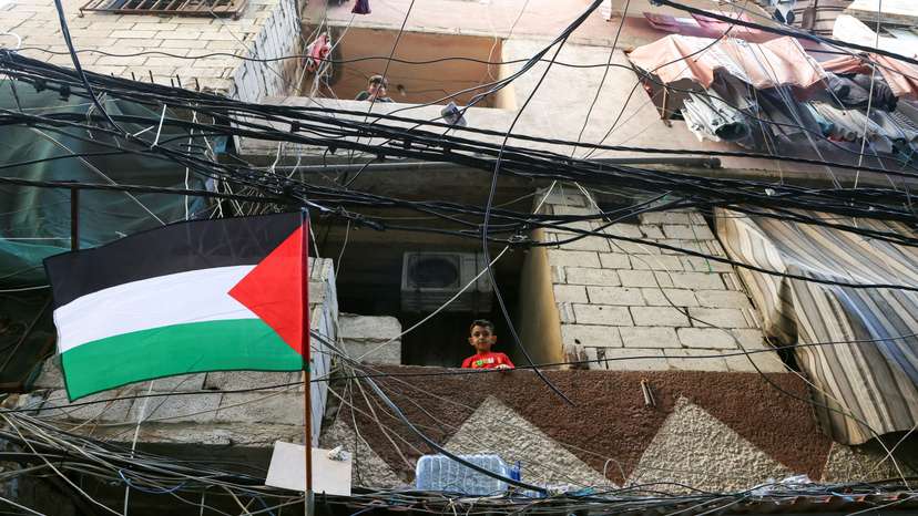 Children look out from balconies in Shatila Palestinian refugee camp, in Beirut