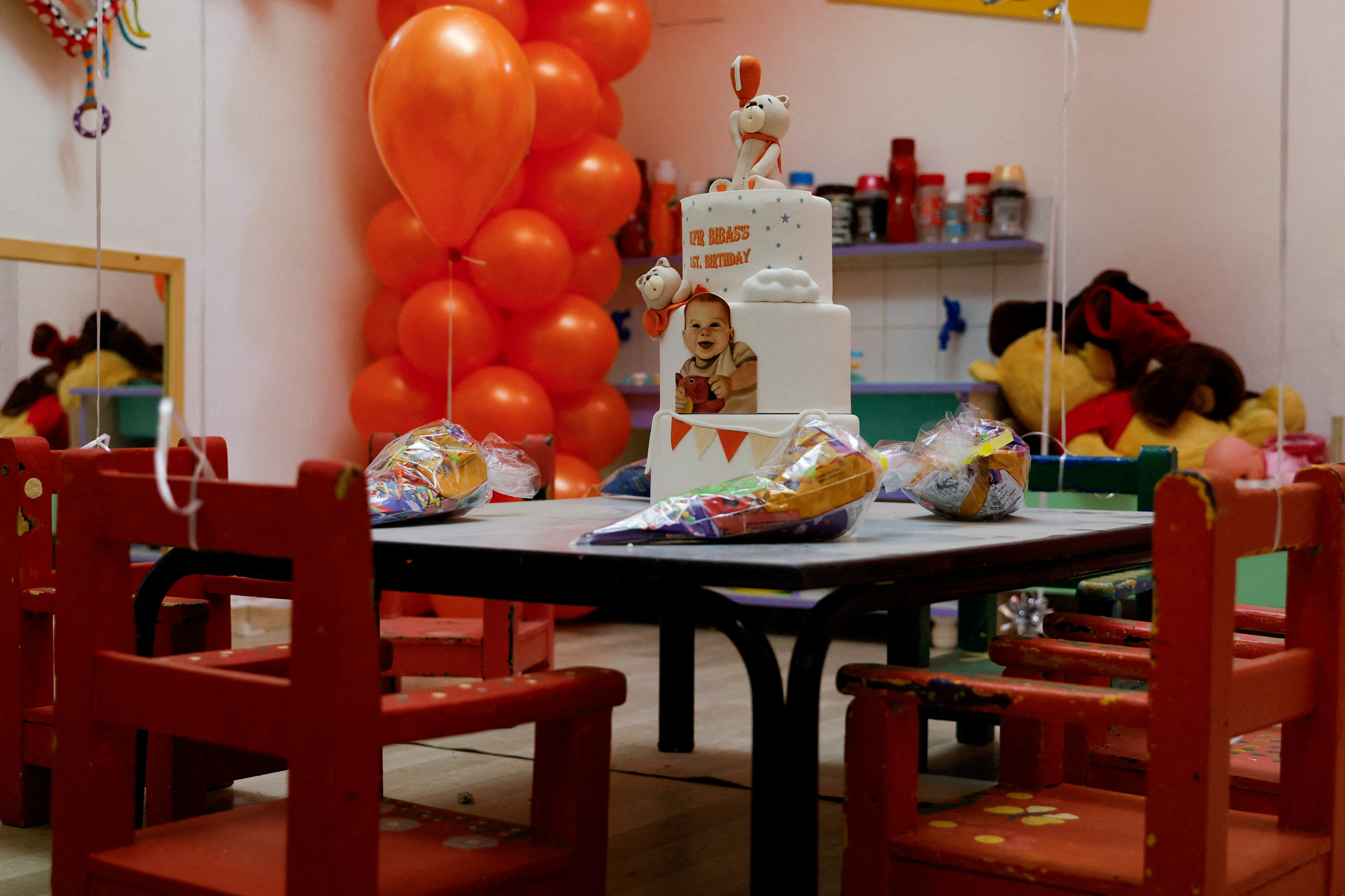 A birthday cake for Kfir Bibas is set up to call for his release, in Kibbutz Nir Oz