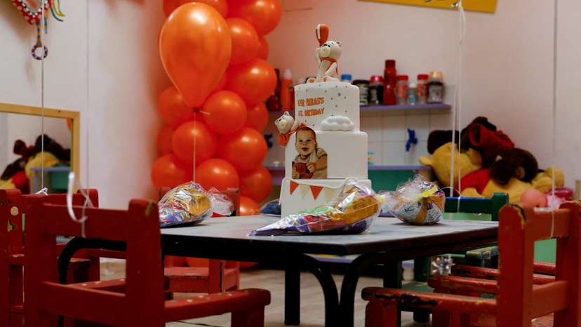 A birthday cake for Kfir Bibas is set up to call for his release, in Kibbutz Nir Oz