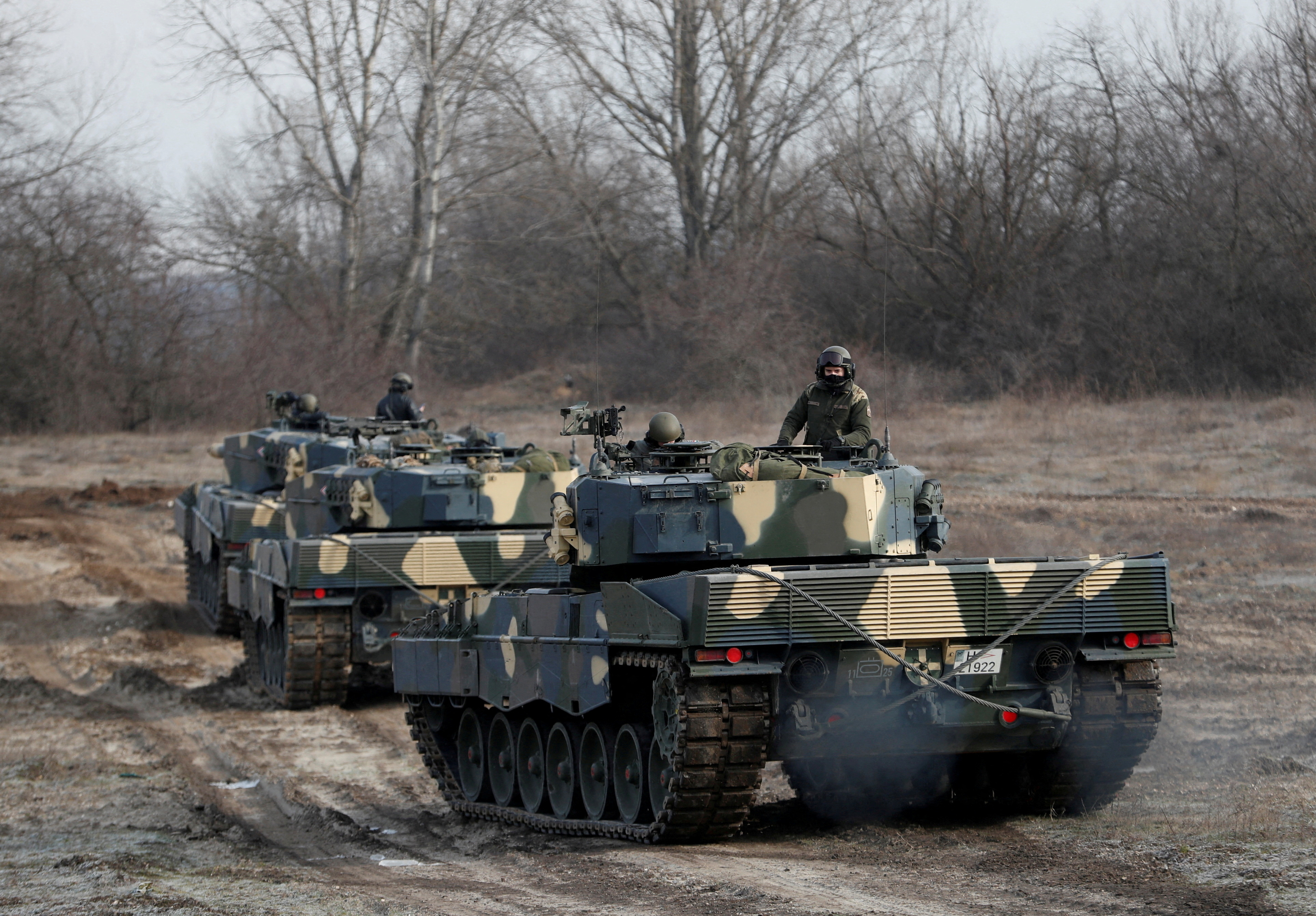 FILE PHOTO: Leopard 2A4 tanks take part in a military training near Tata
