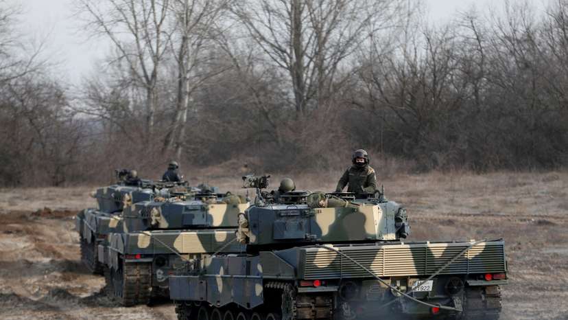 FILE PHOTO: Leopard 2A4 tanks take part in a military training near Tata