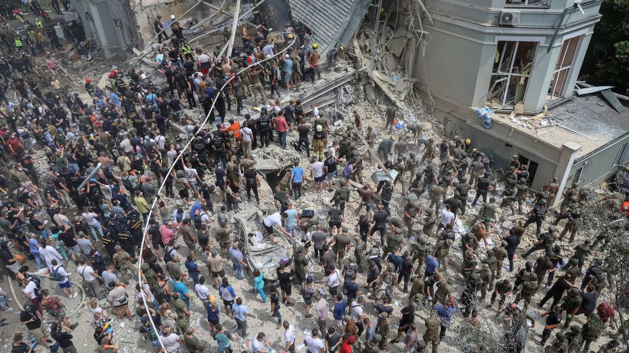 Rescuers and volunteers work at Ohmatdyt Children's Hospital that was damaged during Russian missile strikes, in Kyiv