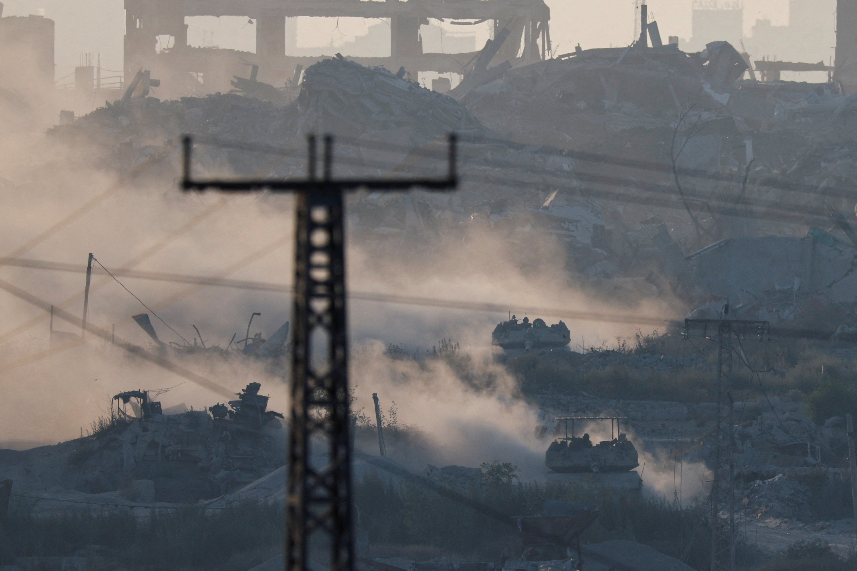 An excavator operates inside Gaza near the Israel-Gaza border, amid the Israel-Hamas conflict, in Israel