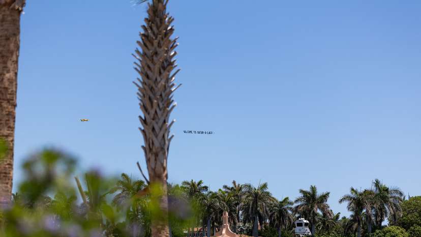 Airplane chartered by the DNC trails a banner reading "Qatar-a-Lago" over Palm Beach