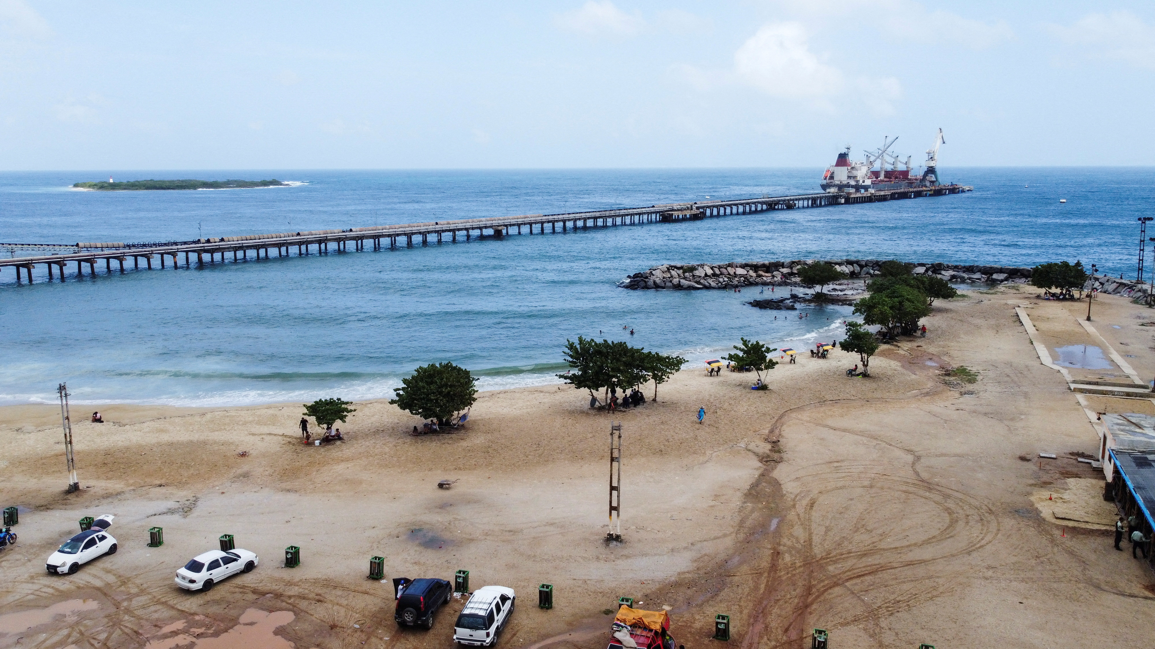 FILE PHOTO: The docks of the Venezuelan state oil company PDVSA subsidiary are seen on the Waikiki beach, in Puerto Cabello