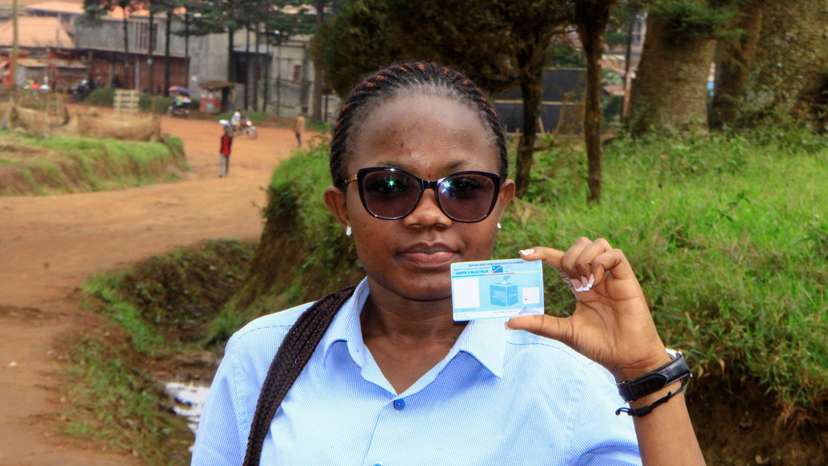 Stephanie Mbafumoja, a Congolese law student holds her voter identity card in L'avenue de L'itav in Butembo