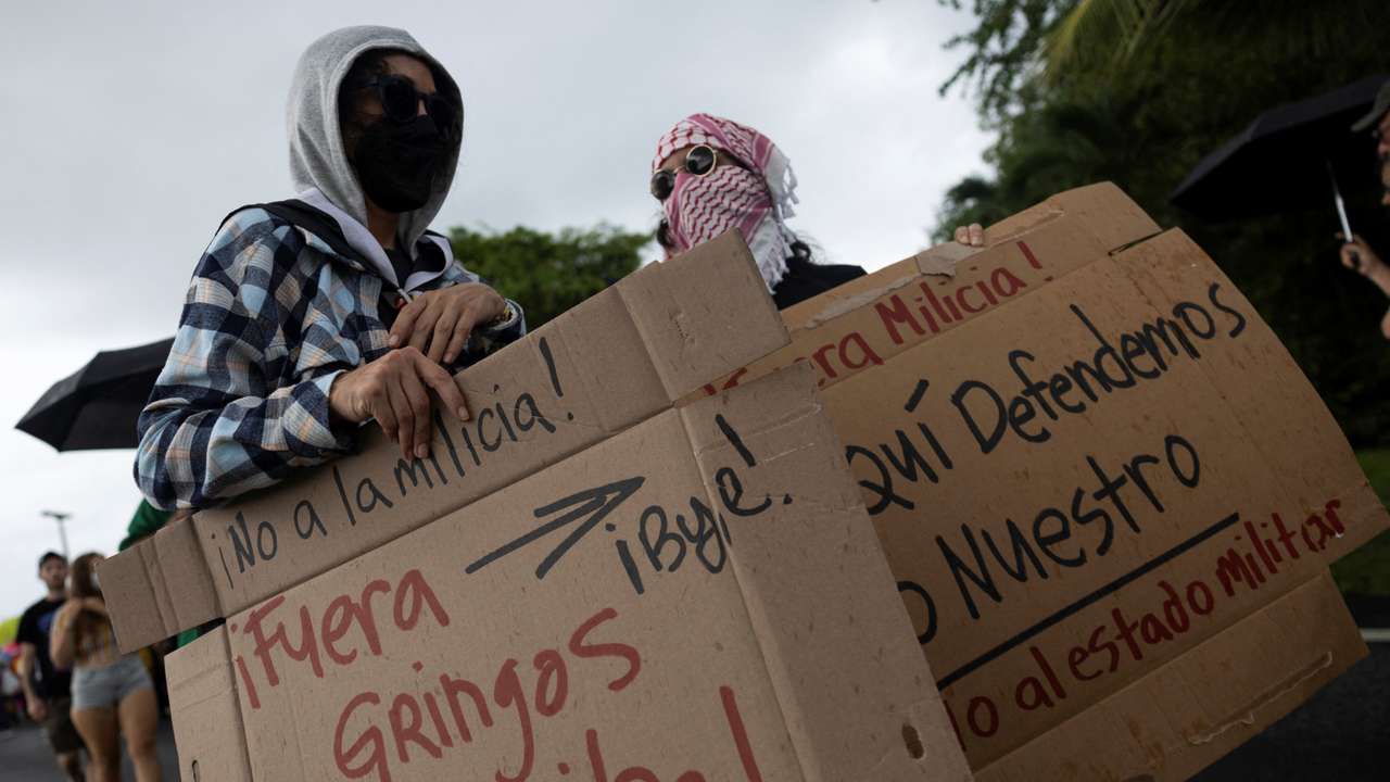 People rally against military exercises in front of the Muniz Puerto Rico Air National Guard Base in Carolina, Puerto Rico, September 7, 2025. REUTERS/Ricardo Arduengo
