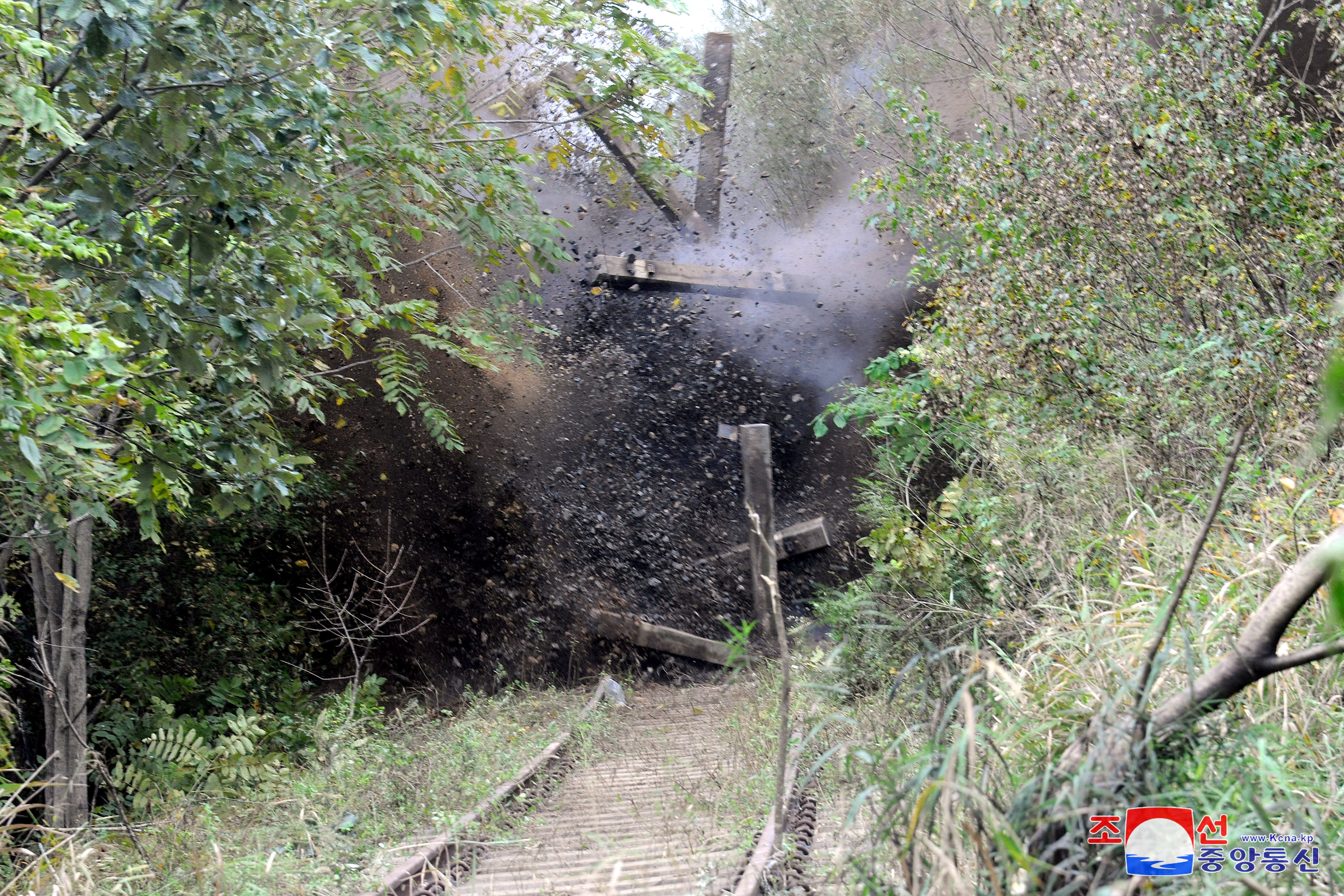 FILE PHOTO: A section of a rail link with South Korea is blasted to completely block it off, according to North Korea's state media, at an undisclosed location along North Korea's southern border area