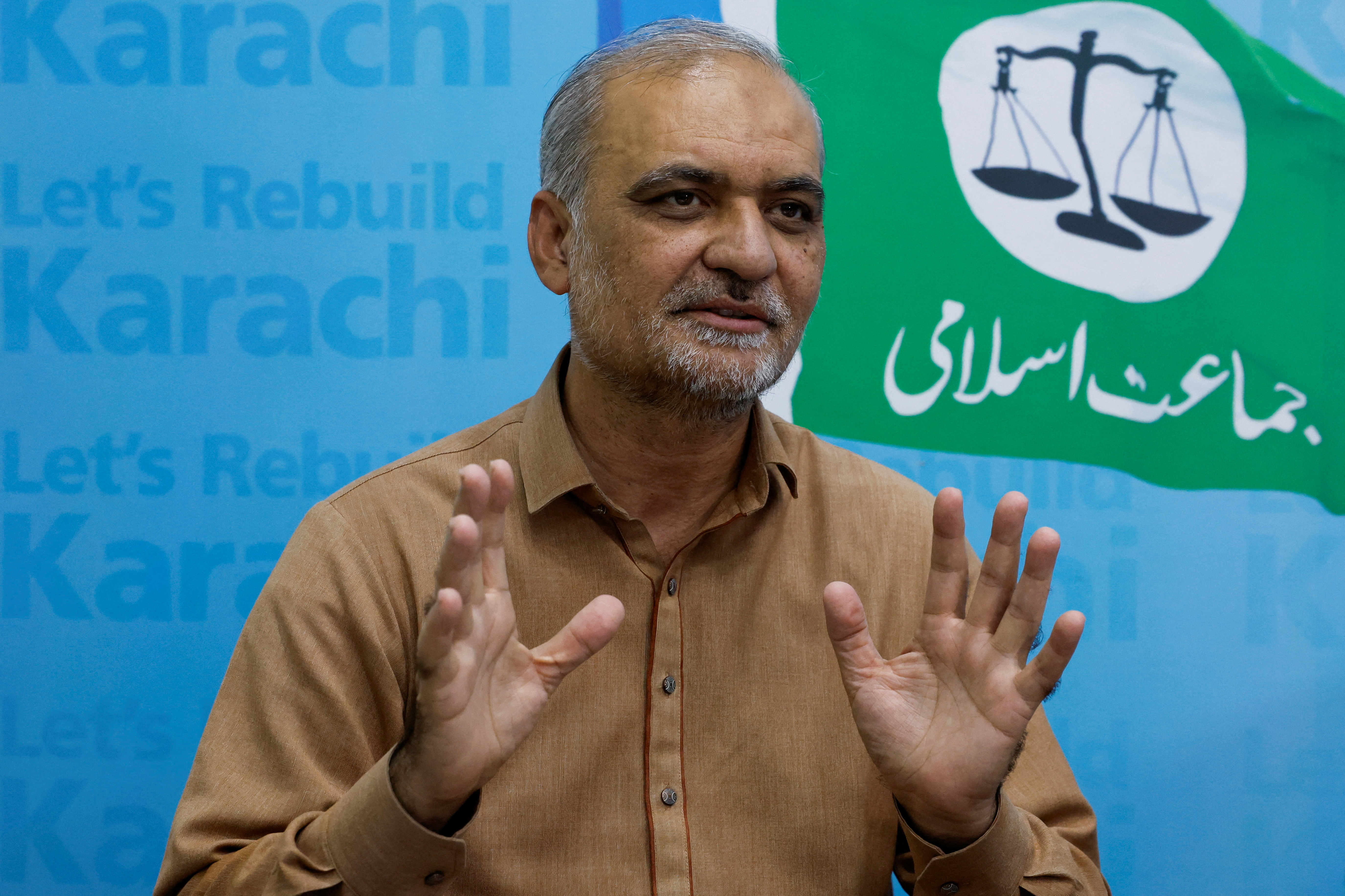 Hafiz Naeem ur Rehman, leader of the religious and political party Jamaat-e-Islami, speaks during an interview with Reuters in Karachi