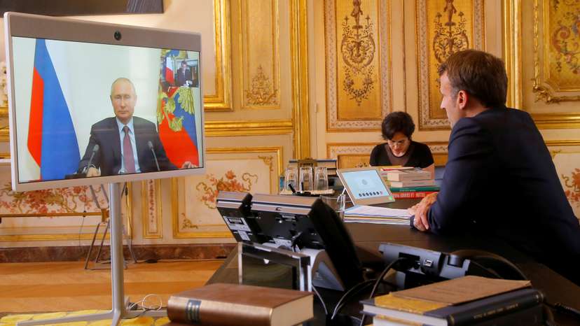 French President Emmanuel Macron holds a video meeting with Russian President Vladimir Putin